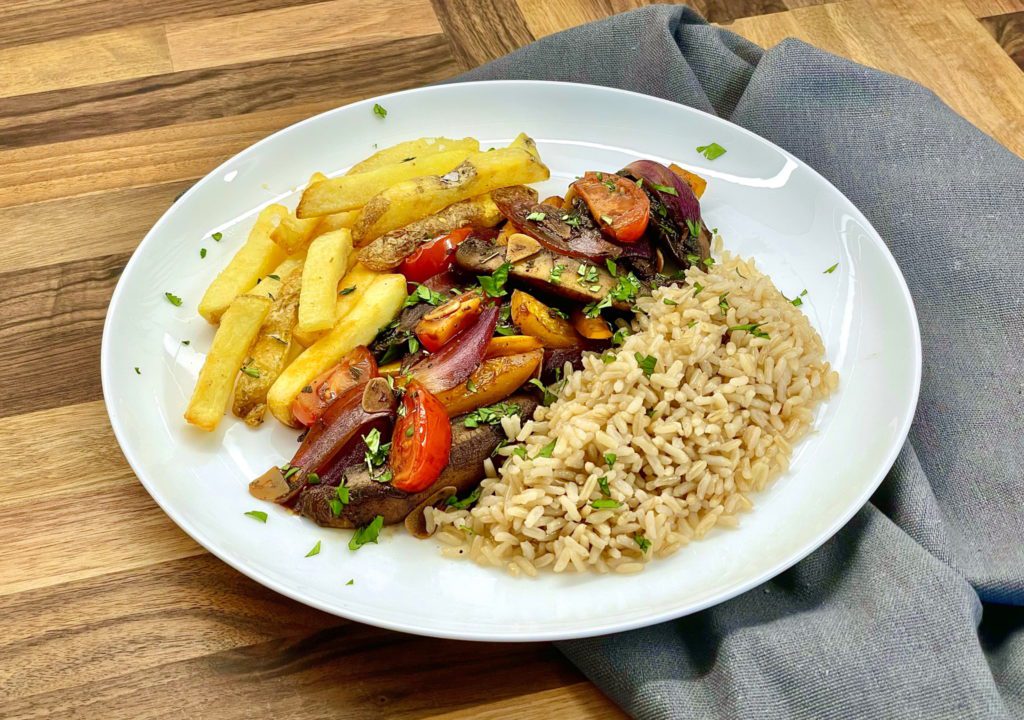 Vegan Peruvian Lomo Saltado - Portobello mushrooms are used to create a delicious vegan version of this dish. Quick and easy to make.