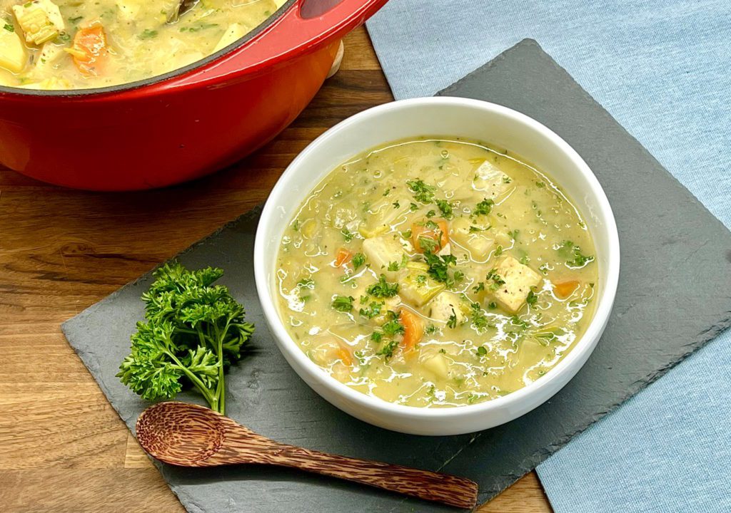 Vegan Waterzooi, a warming Belgian stew made with tofu and celeriac in a creamy sauce. Delicious on its own or served with some fresh crusty bread.