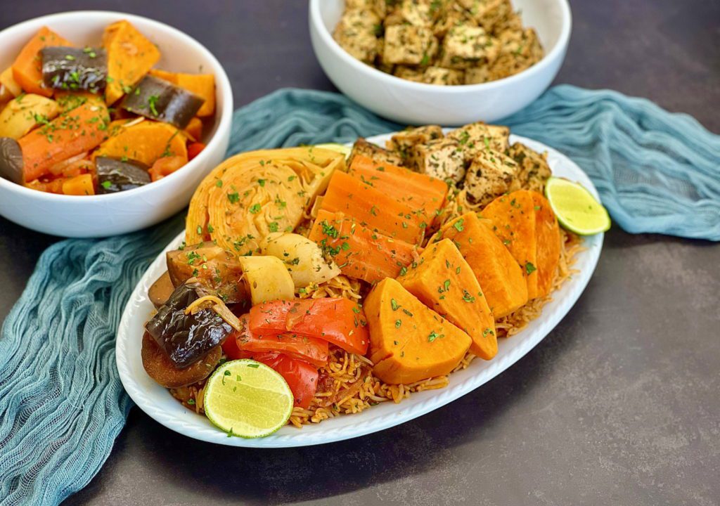 Vegan Tofu Thieboudienne - Ceebu Jen, our vegan version of the National dish of Senegal. Marinated tofu served with rice and vegetables cooked in a spicy tomato broth. 