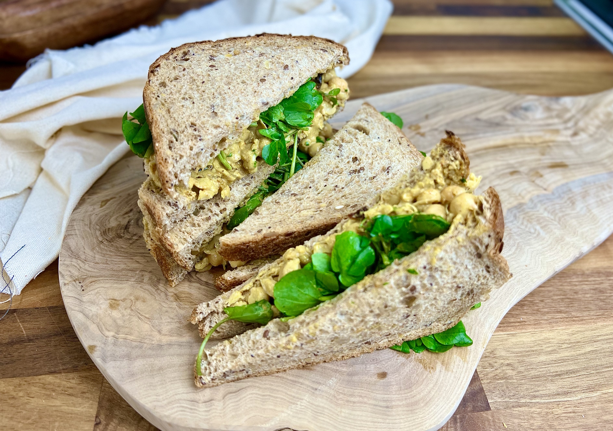 Vegan Coronation Chickpeas, a delicious creamy sandwich filling that’s quick and easy to make and requires no cooking. Chickpeas and raisins in a curry spiced mayo.